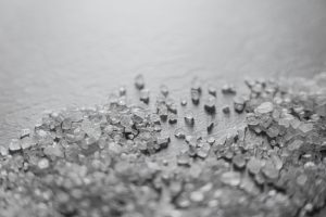 Zinc L-Carnosine (Pepsin Gl) Zinc crystals on a white surface