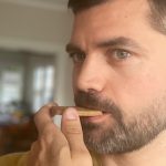 Man munches on an unwrapped Metamucil Wafer