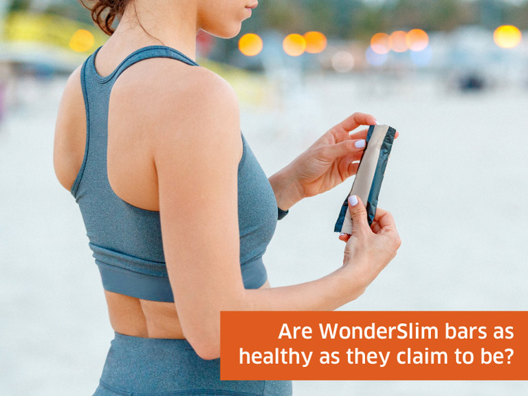 Woman holding WonderSlim bar
